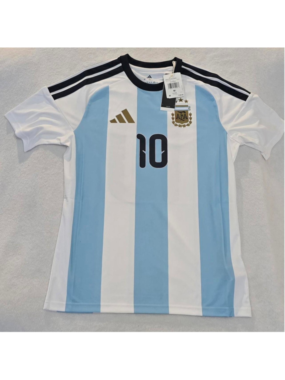 Adidas Argentina jersey with blue/white vertical stripes, size M